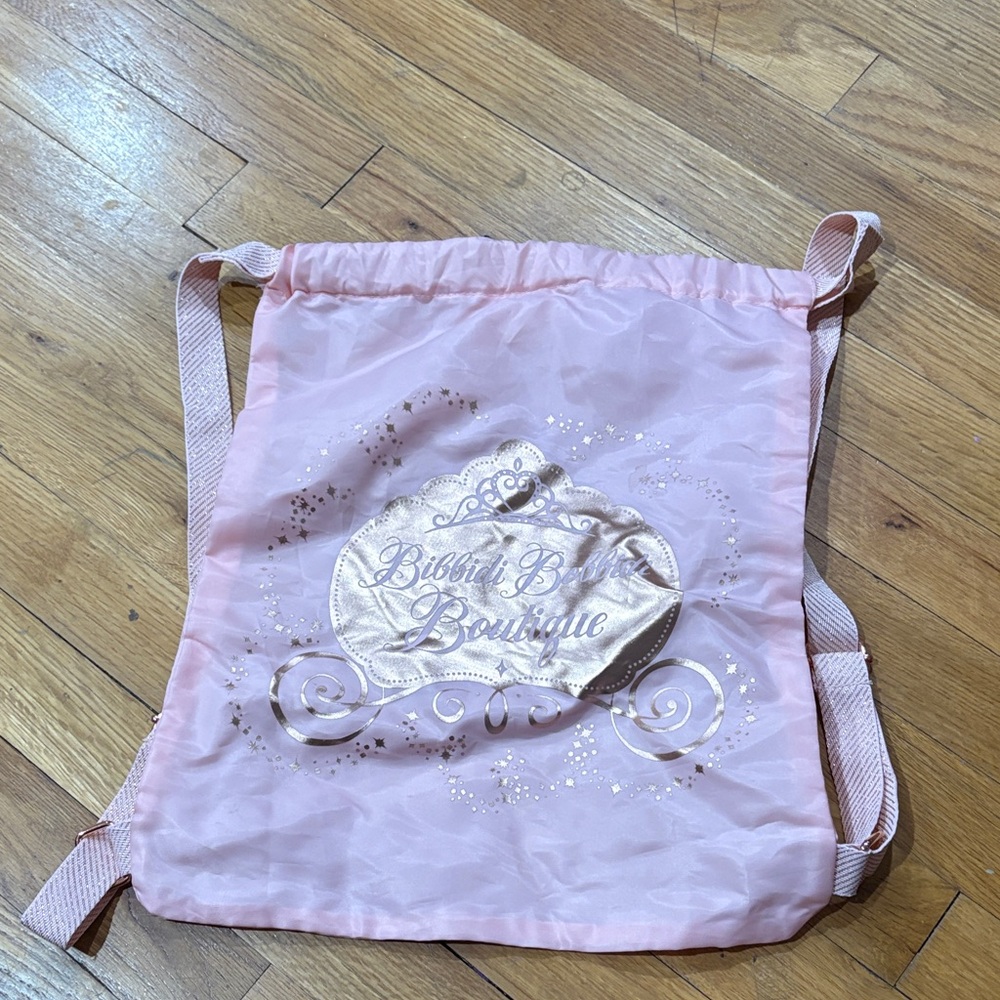 Pink Drawstring Backpack with Gold Carriage Graphic